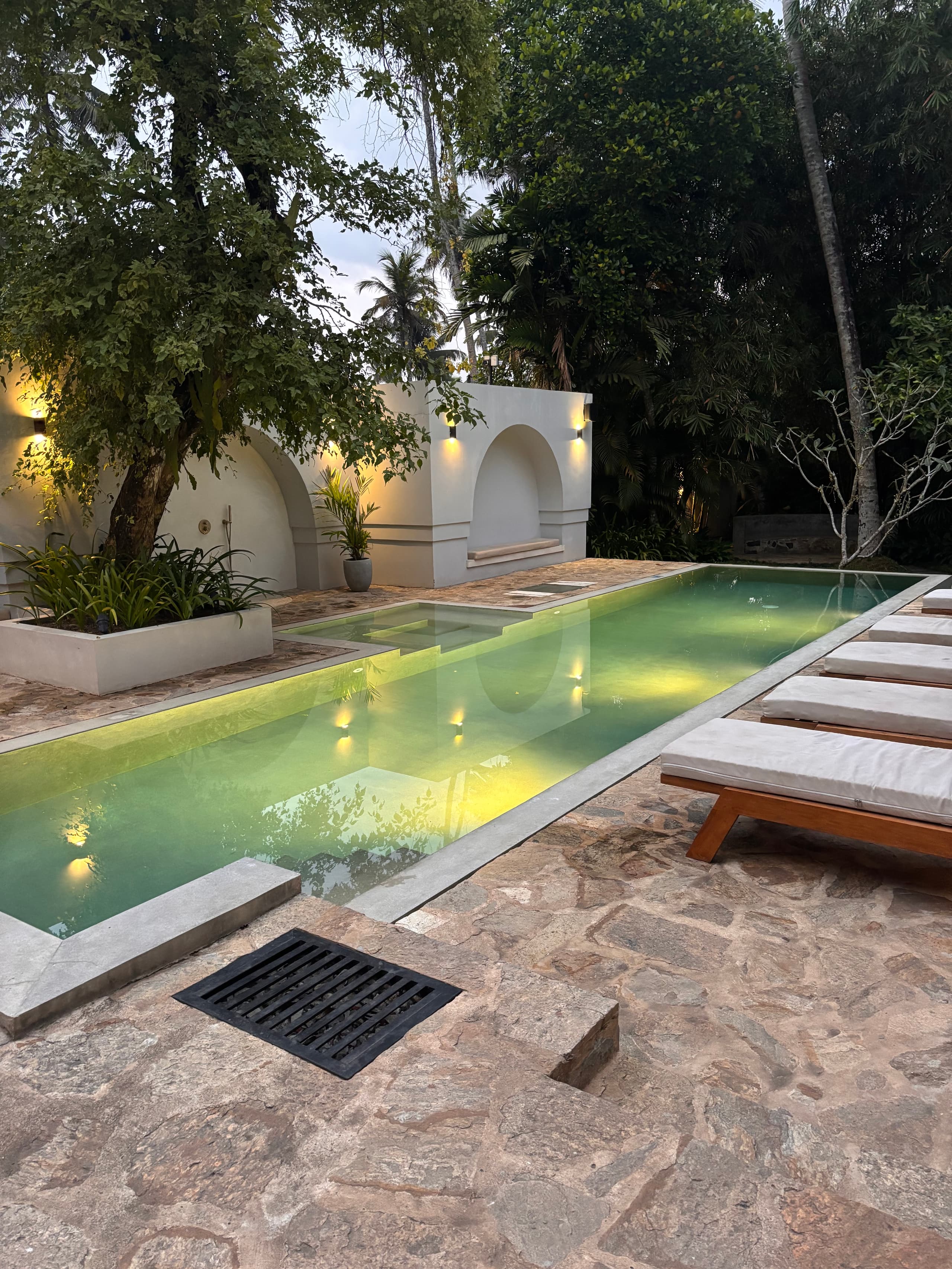 The main pool lit up in the evening